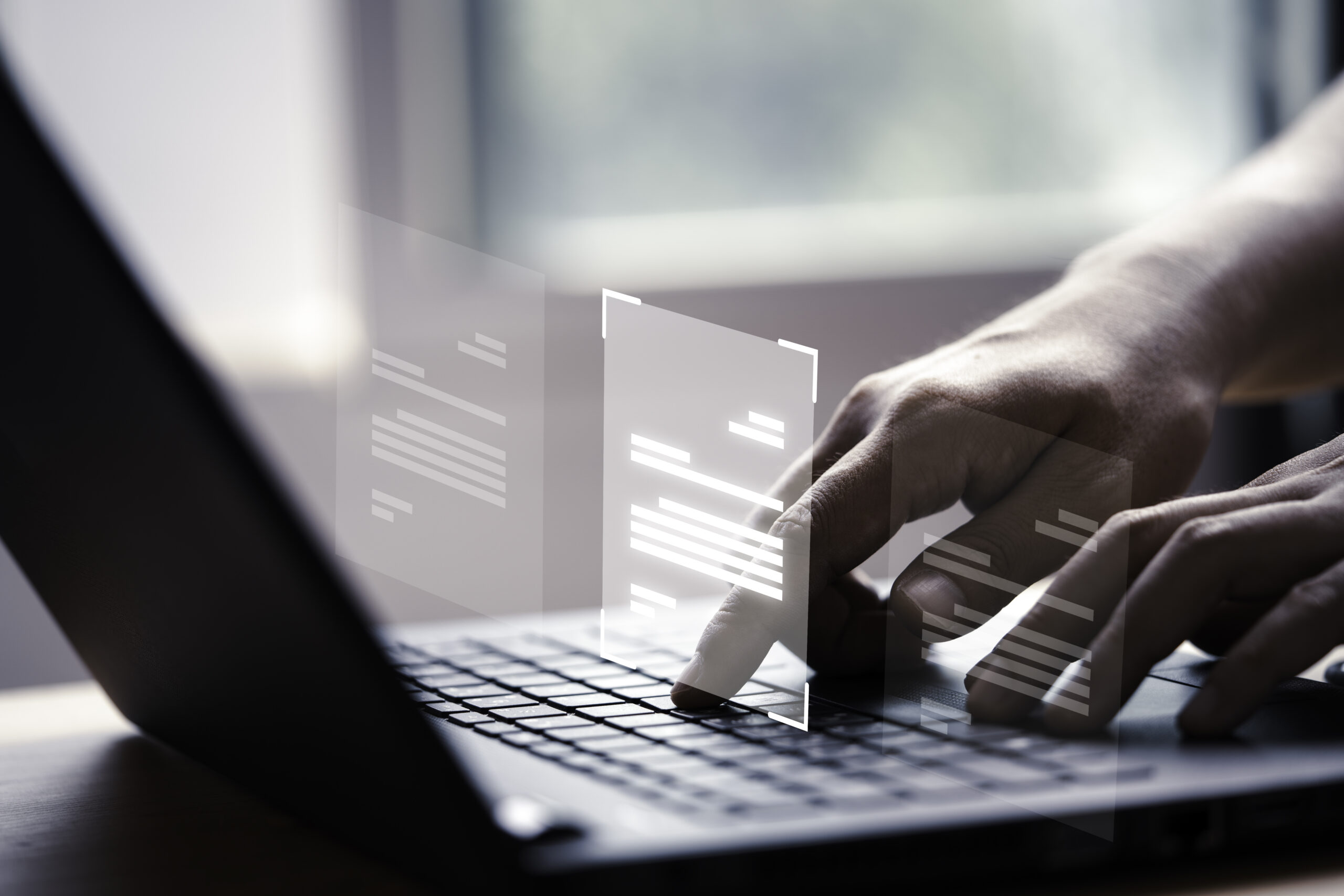 A close-up of a person's hands using a laptop keyboard with a digital overlay of document icons, representing a Data Protection Officer utilizing compliance automation software to manage digital records and DPDP Act requirements